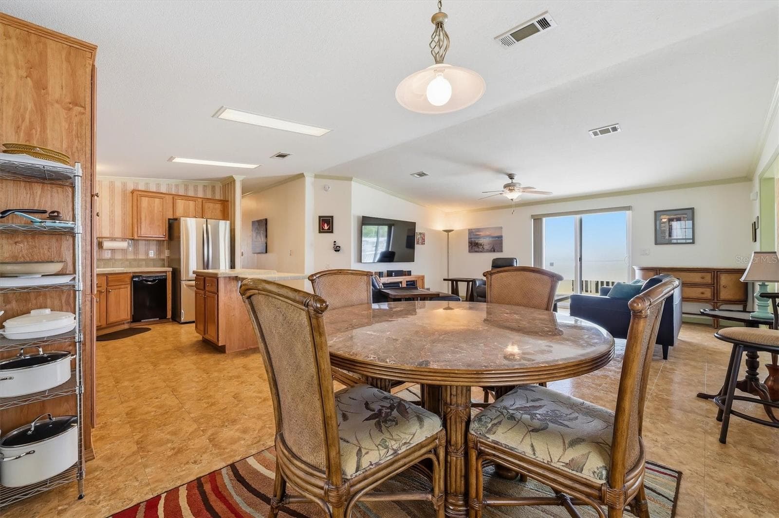 Dining area.  Marble top table, chairs and buffet can remain. - 10027 EQUITY AVE, DADE CITY