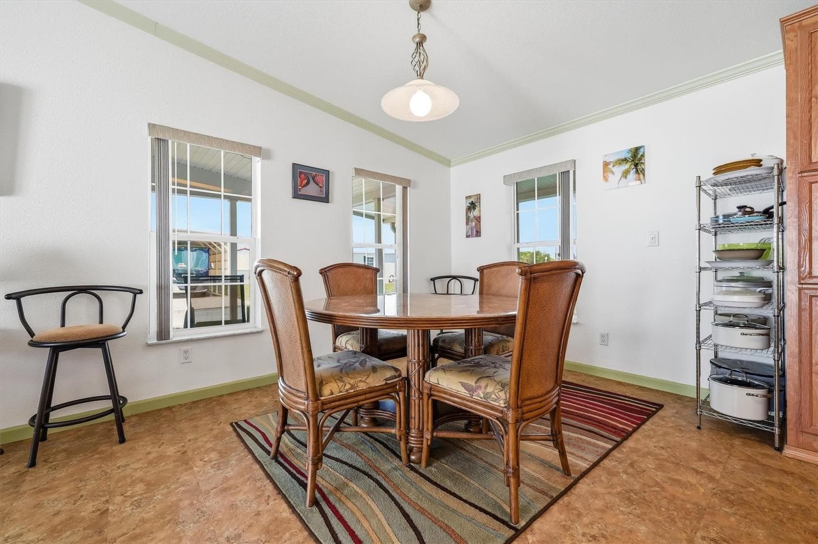 Dining area with picture window views and a lot of light - 10027 EQUITY AVE, DADE CITY
