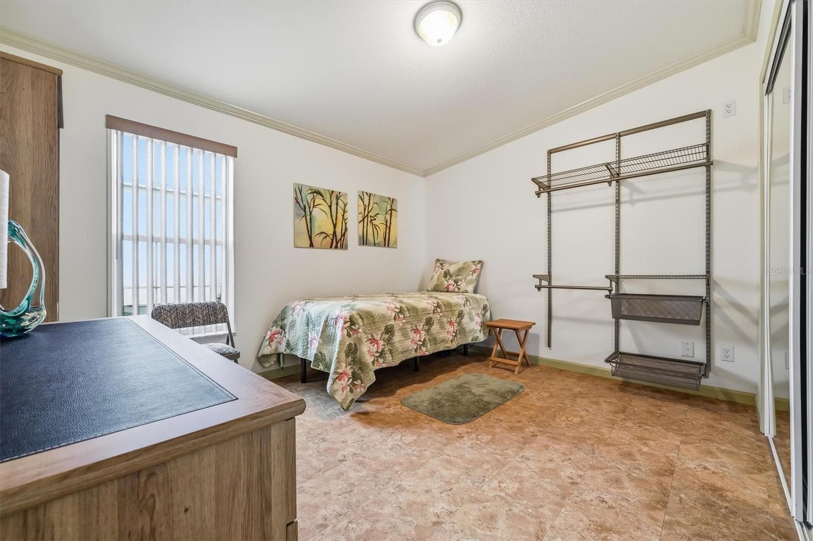 2nd bedroom with large closet and additional wall clothes rack assembly for storage or guests - 10027 EQUITY AVE, DADE CITY