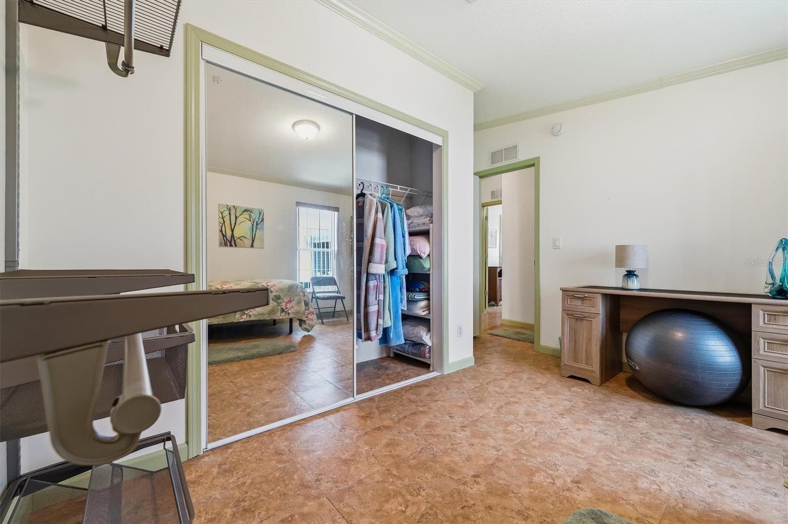 2nd bedroom large closet with additional storage and racking - 10027 EQUITY AVE, DADE CITY