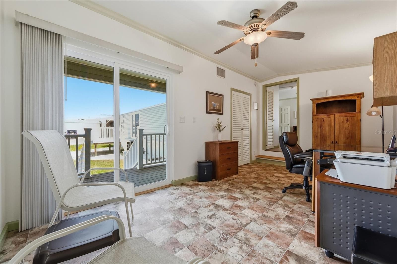 Separate Office or den with picture sliding door and lots of light.  Some office furniture can remain. - 10027 EQUITY AVE, DADE CITY