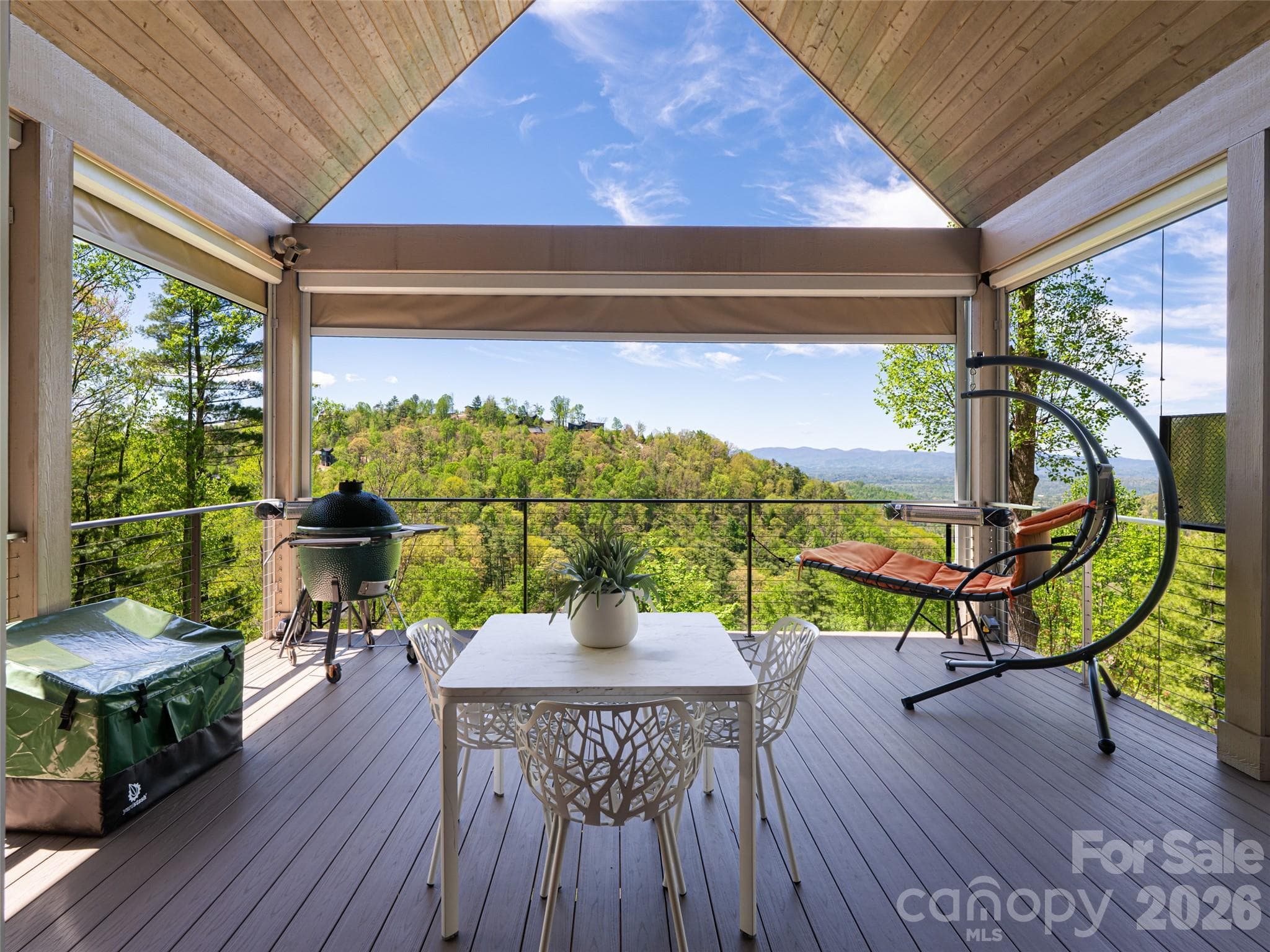 Accordion sliding glass doors allow for seamless access to the upper deck. - Asheville