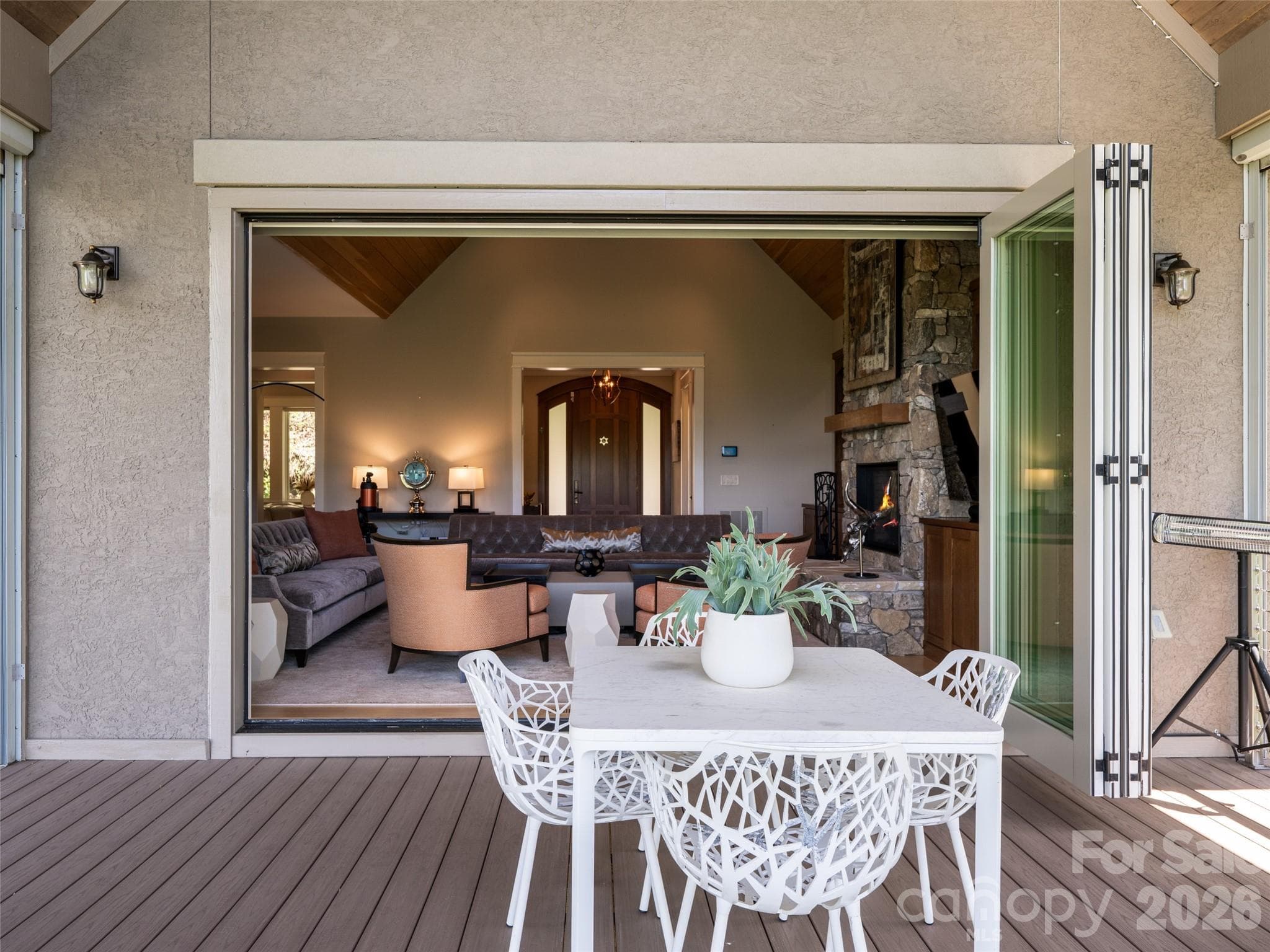Accordion sliding doors open from Great Room to deck to create a never-ending indoor/outdoor setting - 32 Timberwolf Court, Asheville