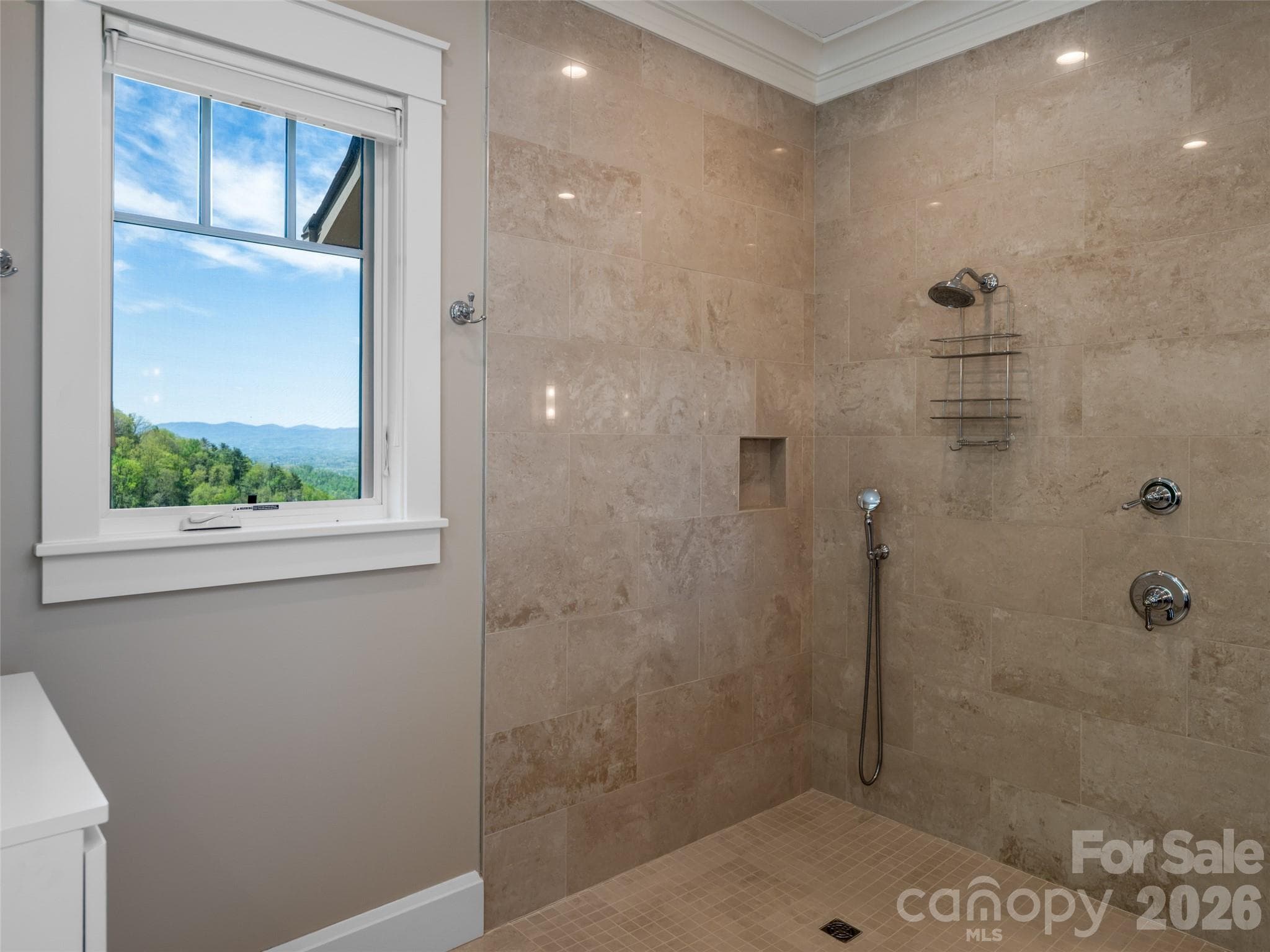 Primary shower with another stunning view of the long range mountains. - 32 Timberwolf Court, Asheville