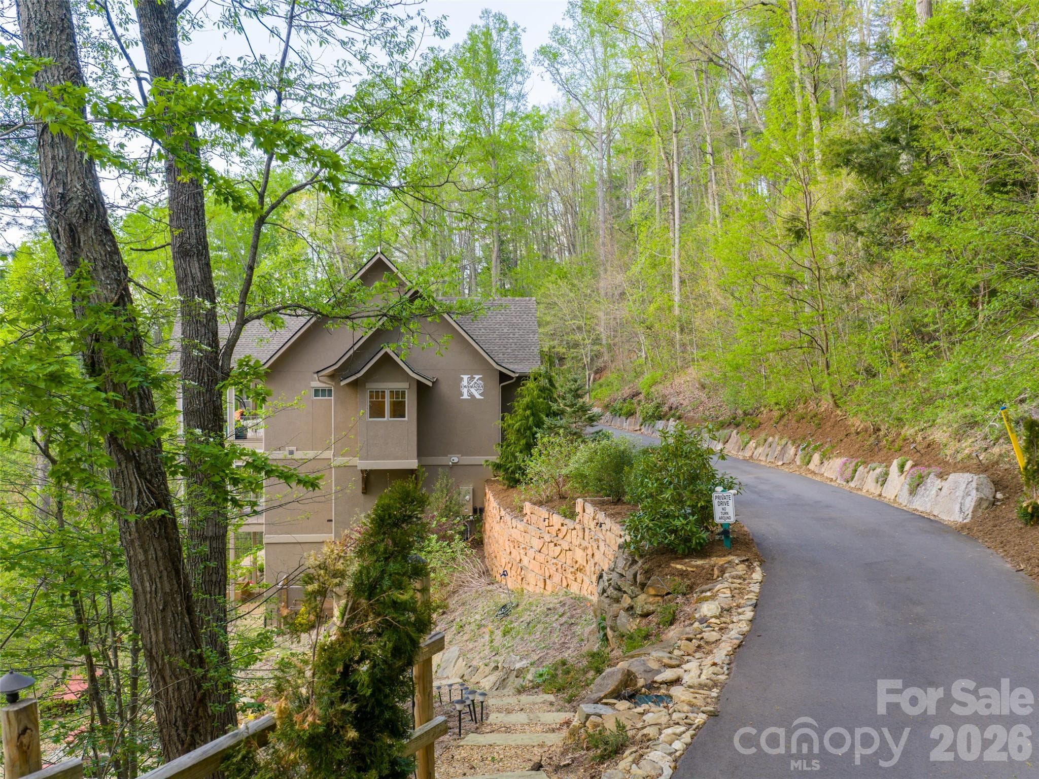 Privacy and stunning entryway allow you to discover this mountain masterpiece - 32 Timberwolf Court, Asheville