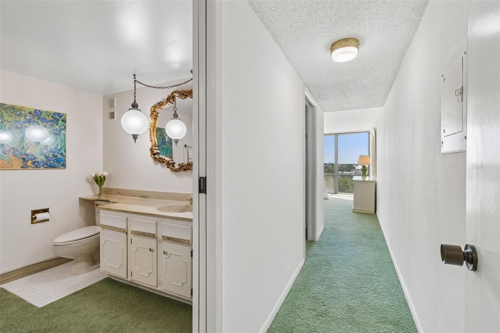 Primary hallway and entrance to primary bath - 80 ROGERS ST #6C, CLEARWATER