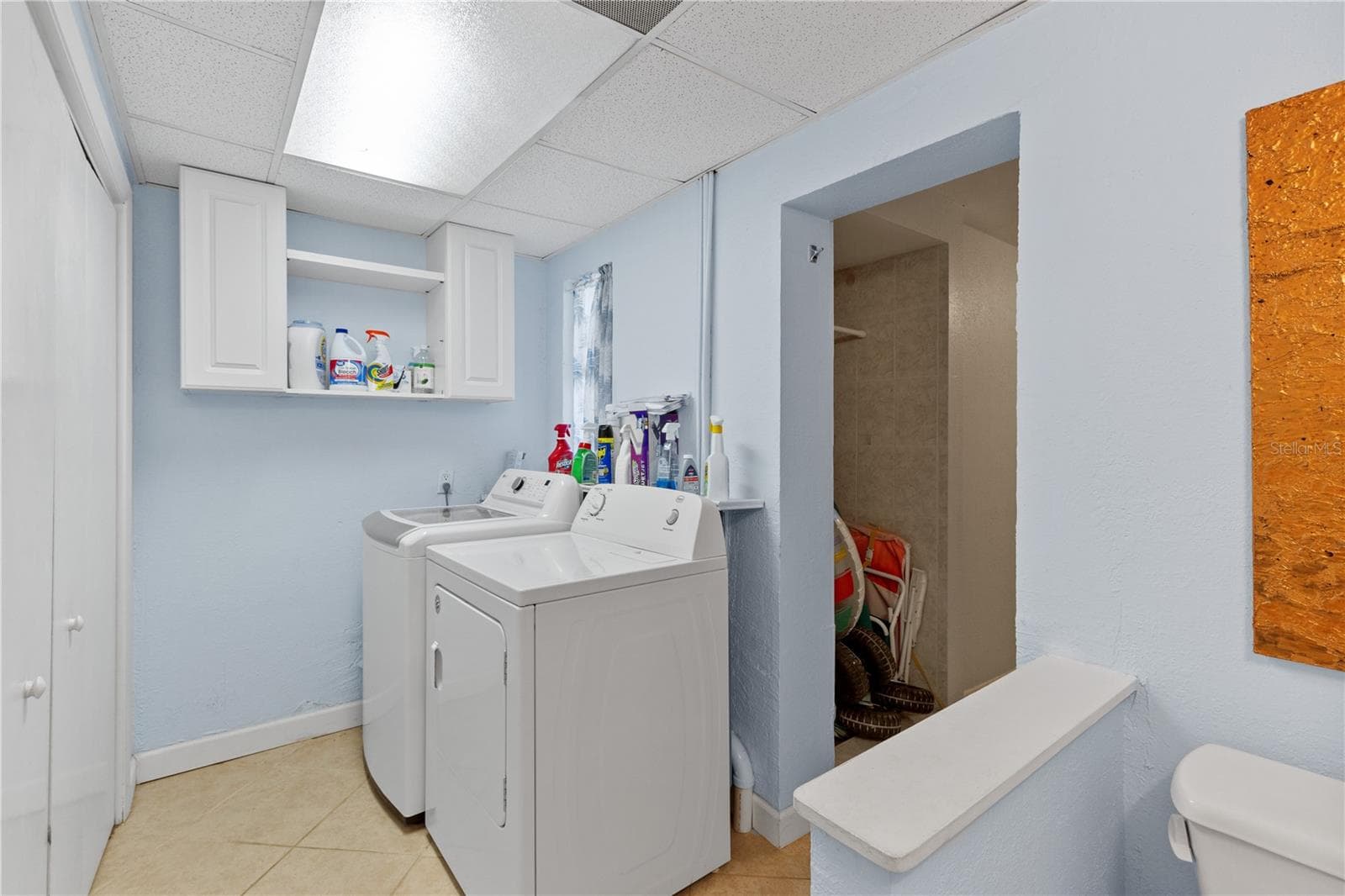 Laundry Room Pool half bath outside door to pool - 7860 HOLIDAY DR, SARASOTA