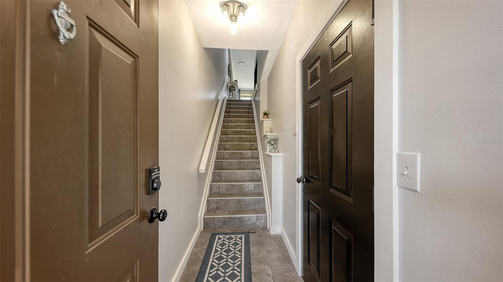 The first level has a dedicated one car garage, accessible from inside the home. - 5655 BENTGRASS DR #9-116, SARASOTA