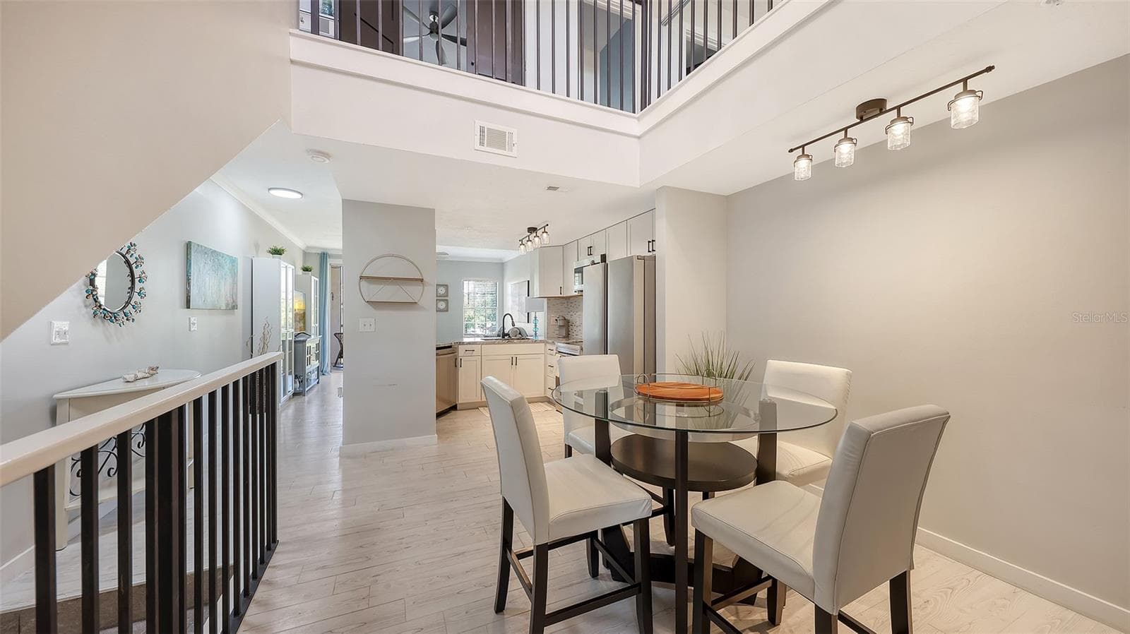 A beautiful dining area is large enough for family and friends. - 5655 BENTGRASS DR #9-116, SARASOTA