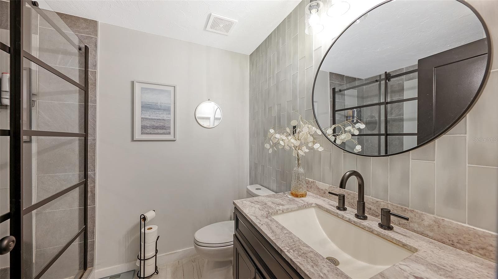 This fully renovated bath is on the same level as the kitchen and living area. - 5655 BENTGRASS DR #9-116, SARASOTA