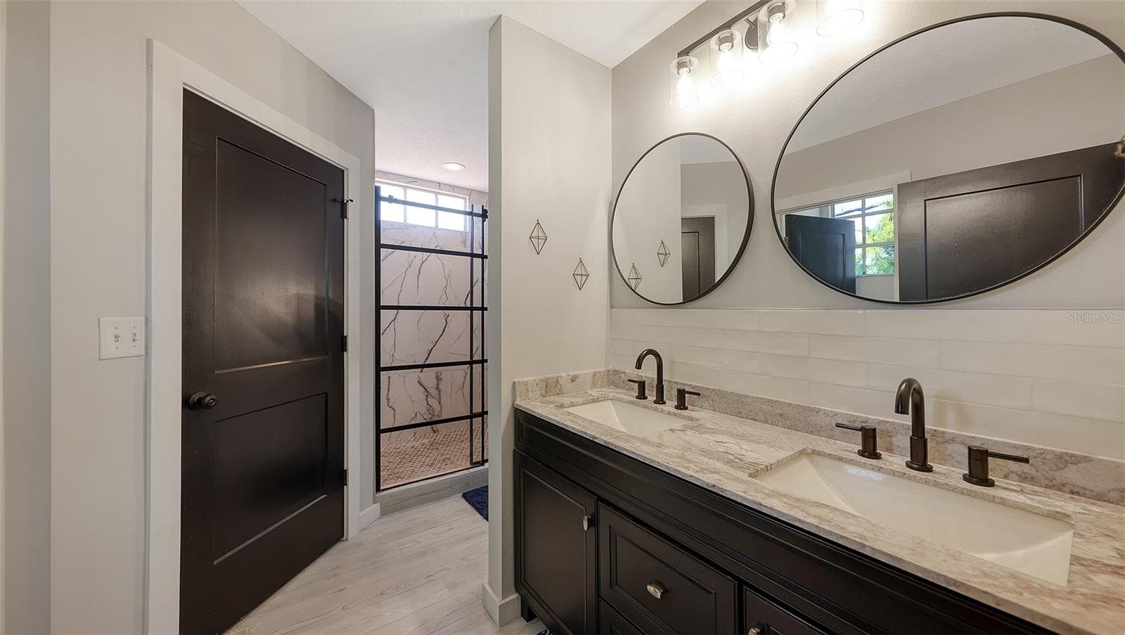 The spa like main bathroom has been completely renovated. - 5655 BENTGRASS DR #9-116, SARASOTA