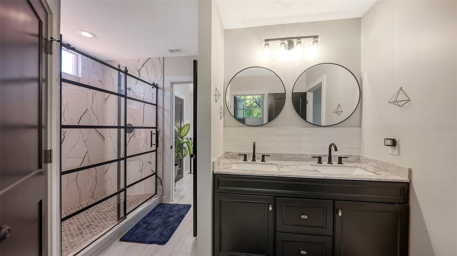 An oversized walk-in shower adds to the serenity of the bath. - 5655 BENTGRASS DR #9-116, SARASOTA