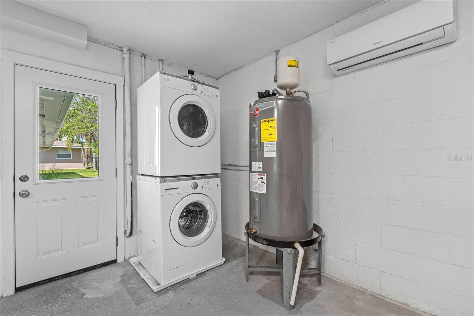 Washer, Dryer and Hot Water Heater in garage - 1794 SANTA BARBARA DR, DUNEDIN