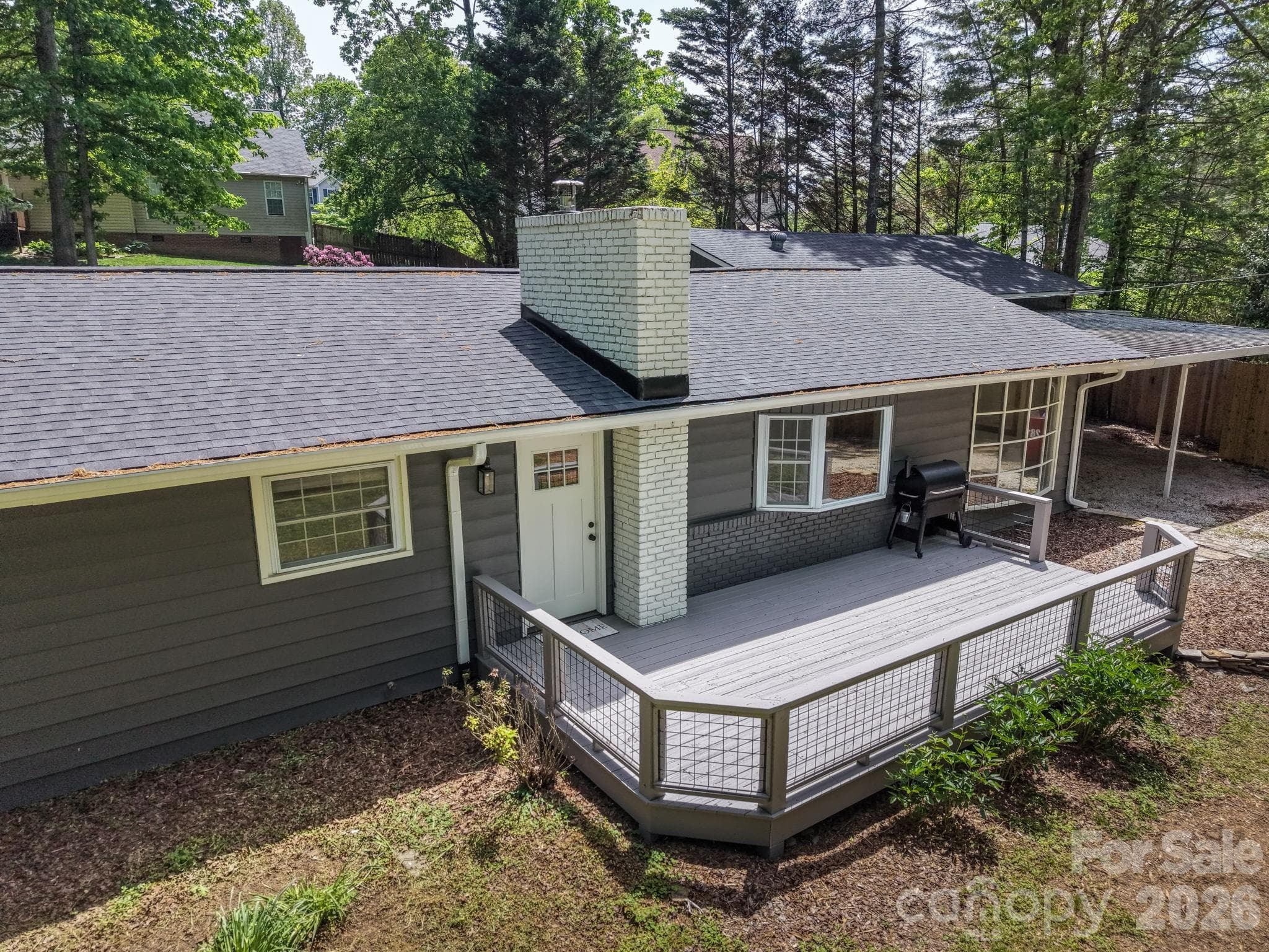A welcoming front entrance paired with a spacious deck - Arden