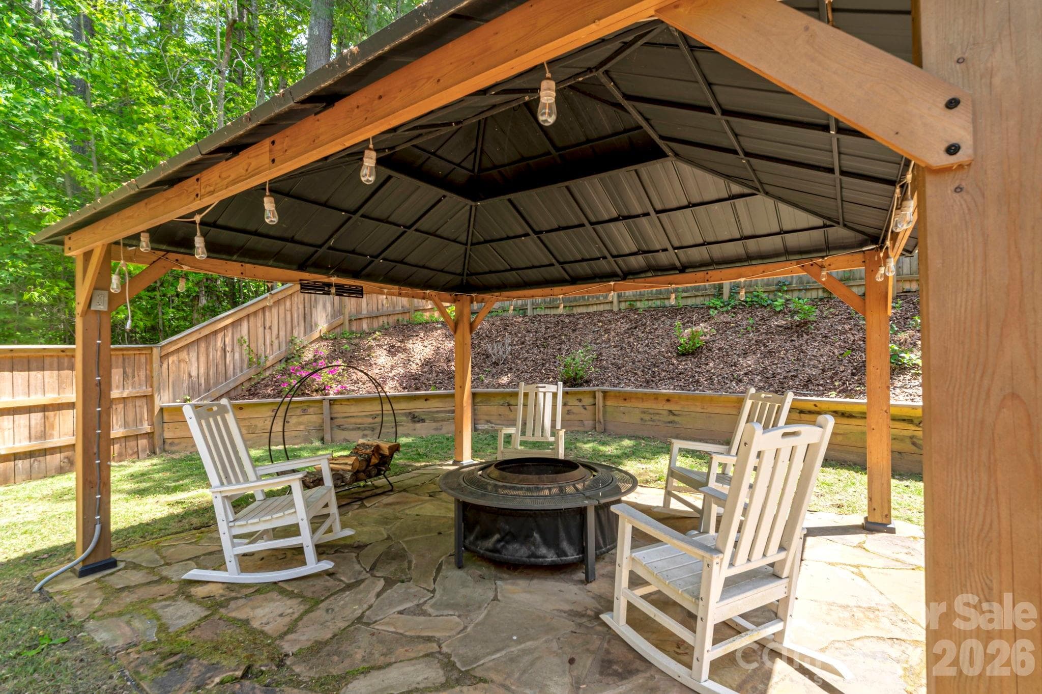 Create unforgettable moments in this dedicated outdoor gathering space. - Arden