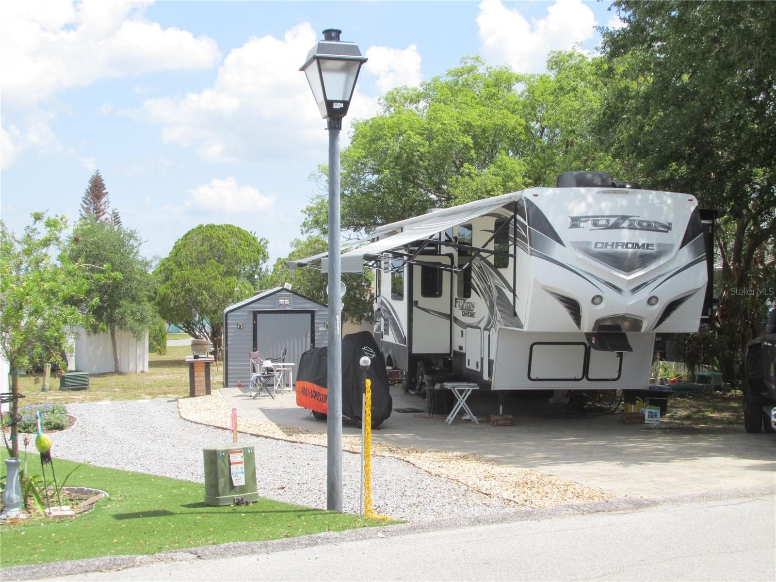 Shaded RV lot with pavered parking pad. - 16 SADDLEBAG TRL S, LAKE WALES