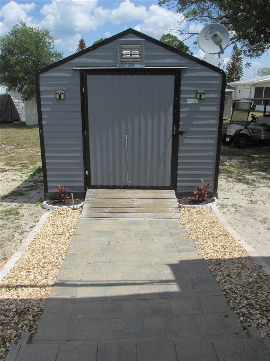 Shed has solar powered lighting and and exhaust fans. - 16 SADDLEBAG TRL S, LAKE WALES