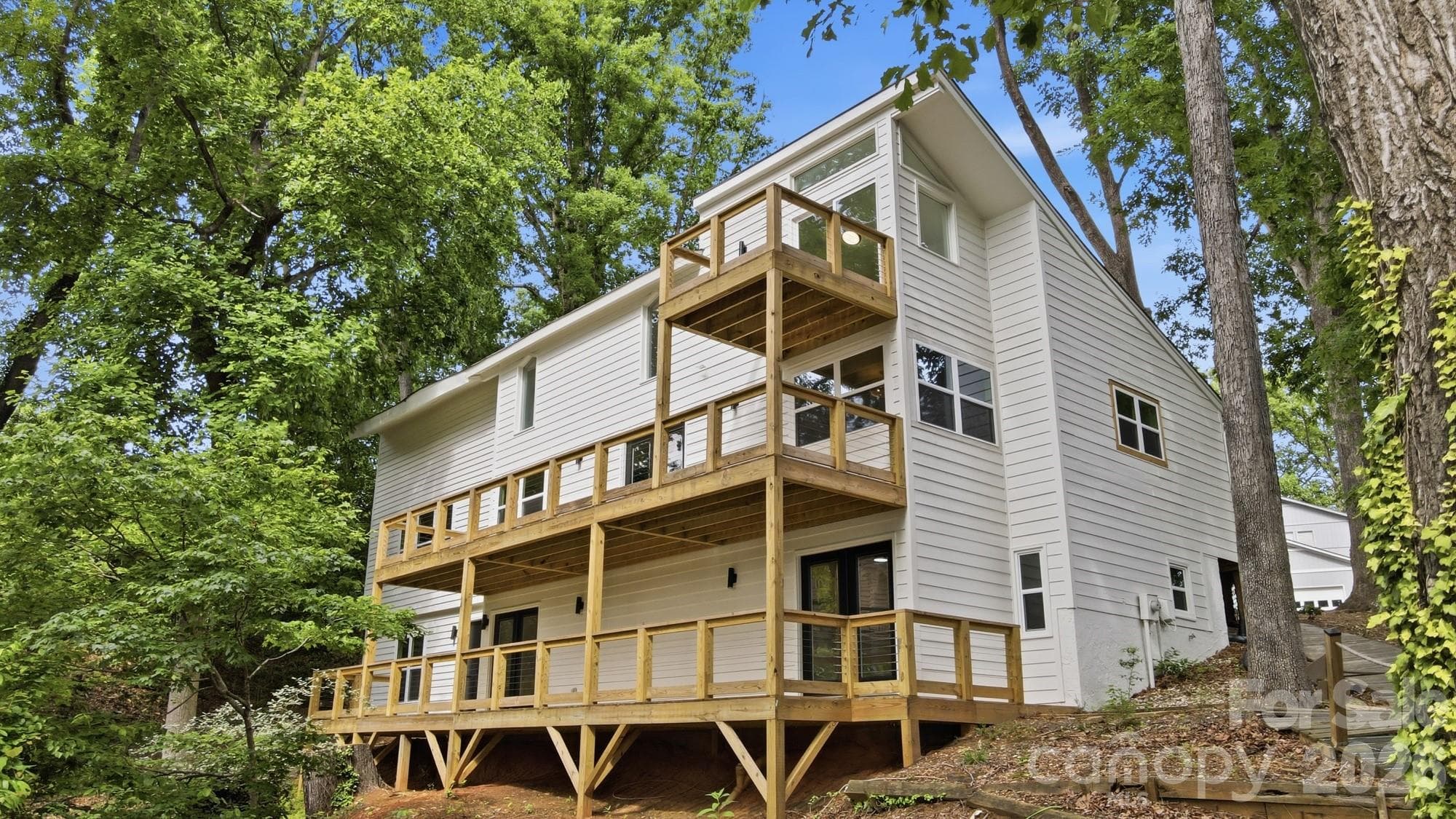 Plenty of room to spread out and entertain across multiple decks — every one with a lake view. - Tega Cay