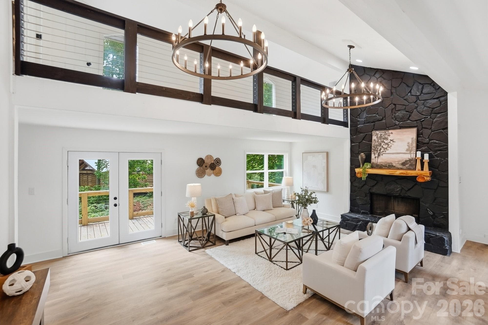 Soaring two-story great room centered around a stunning stone wood-burning fireplace. - Tega Cay