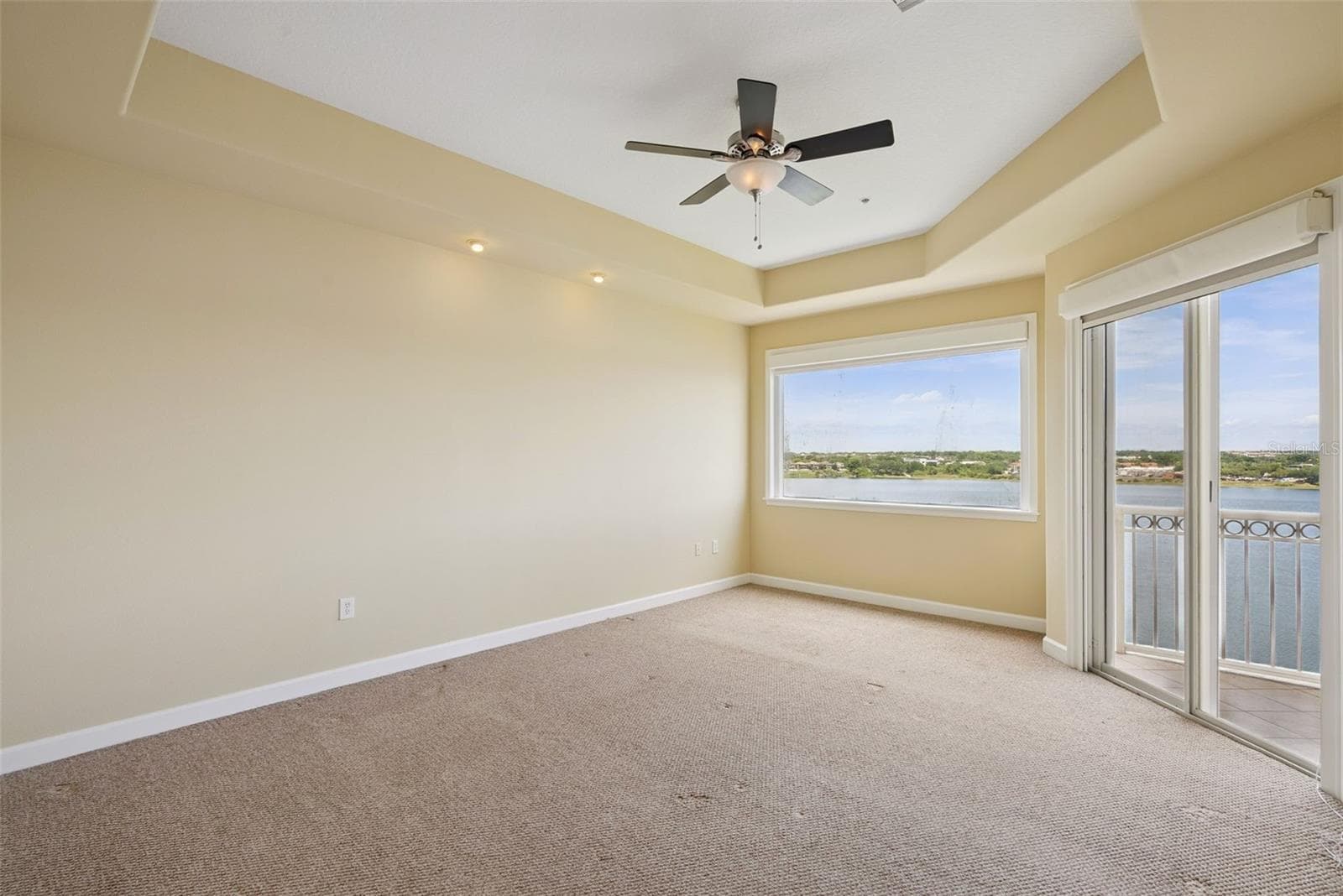 Primary bedroom with balcony access - 8743 THE ESPLANADE #34, ORLANDO