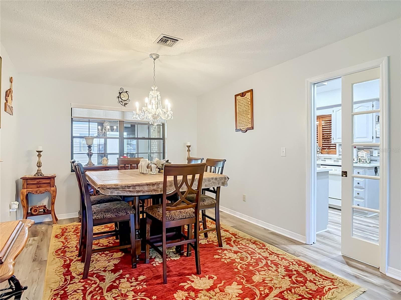 Pocket door from kitchen into dining area - 17819 PALM ST, UMATILLA
