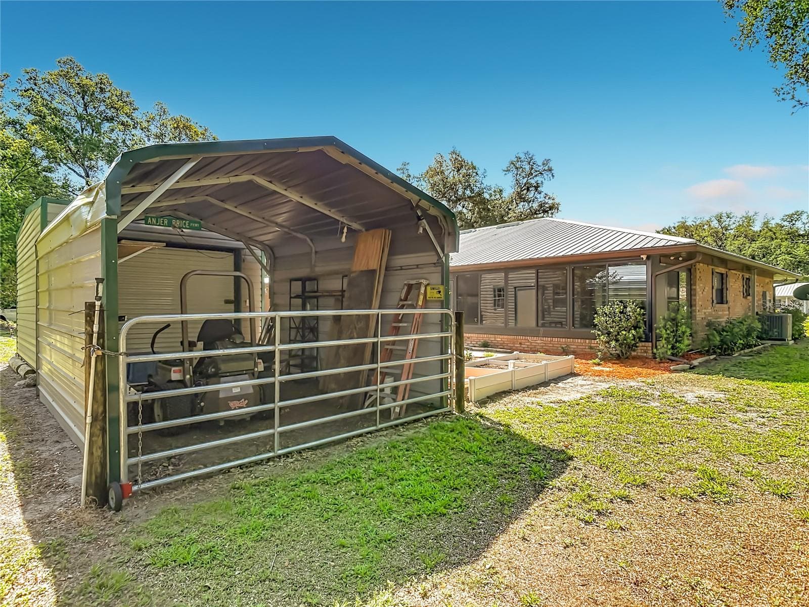 Carport perfect for tractor and boat storage - 17819 PALM ST, UMATILLA