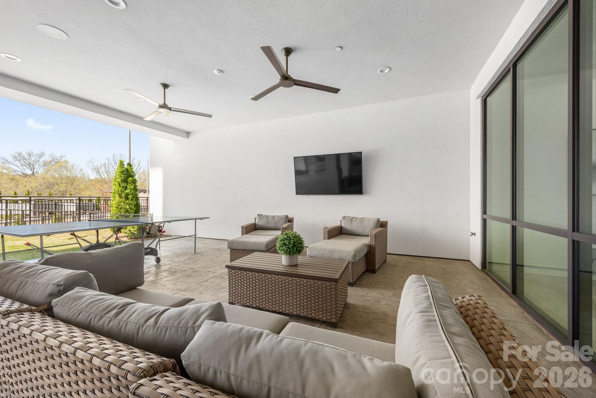 Outdoor covered tv space near pool - 19329 Watermark Drive, Cornelius