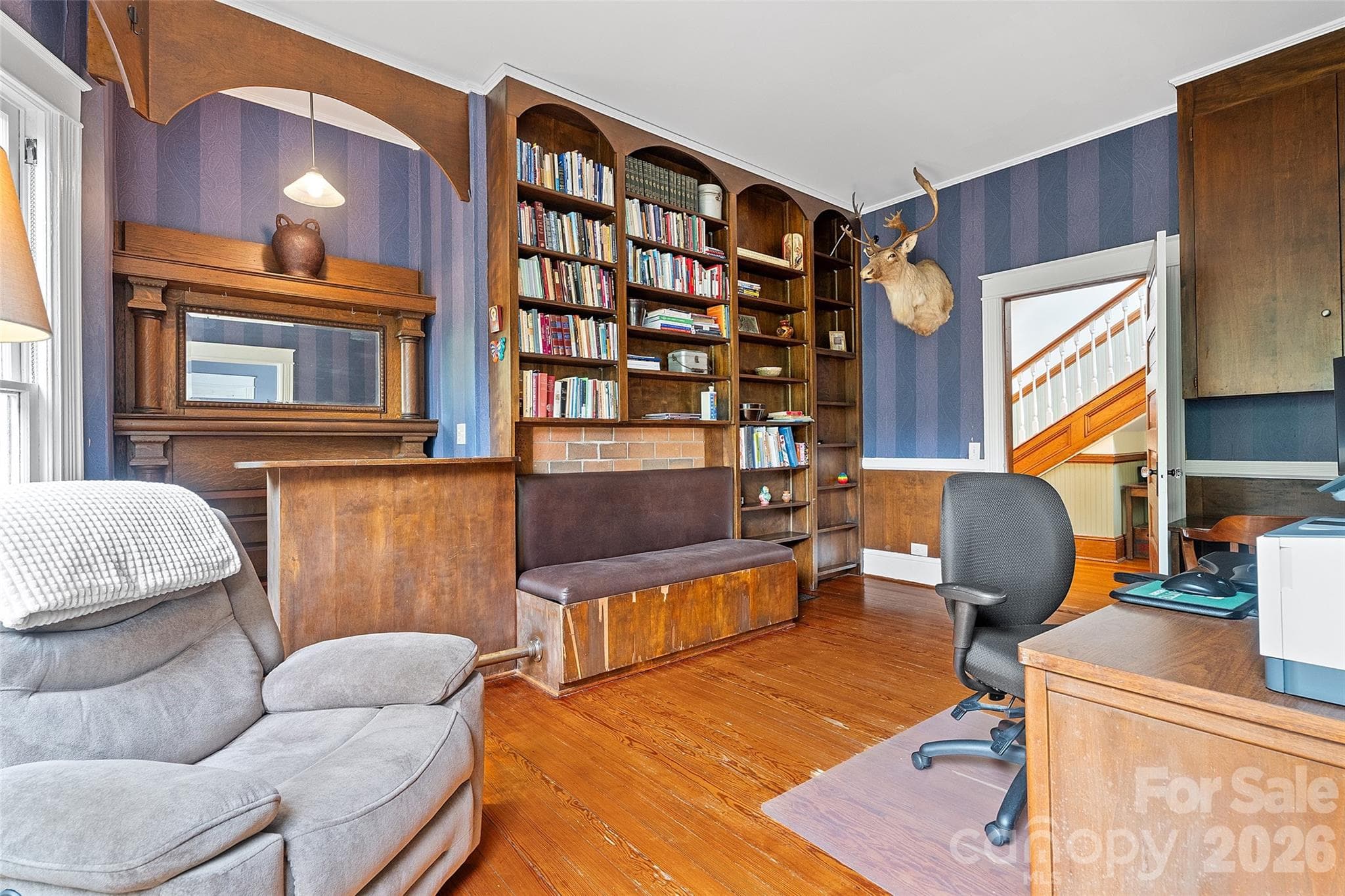Study connected to primary bedroom with timeless woodworking and built in bench seat, bar and classic mantel. - 602 N Main Street, Davidson