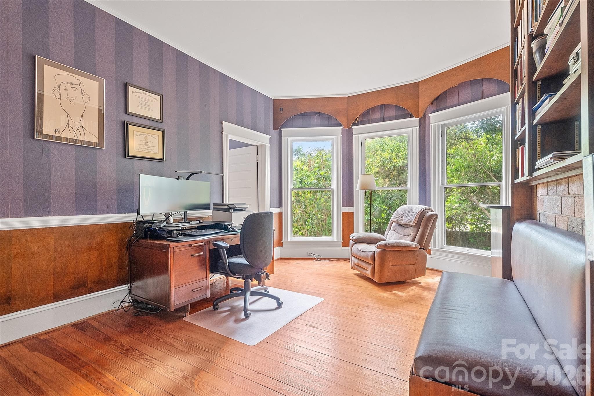 The main-level primary suite includes an ensuite bath and an attached true study. An expansion of the primary bedroom into the adjoining study is well within the realm of possibility. - 602 N Main Street, Davidson