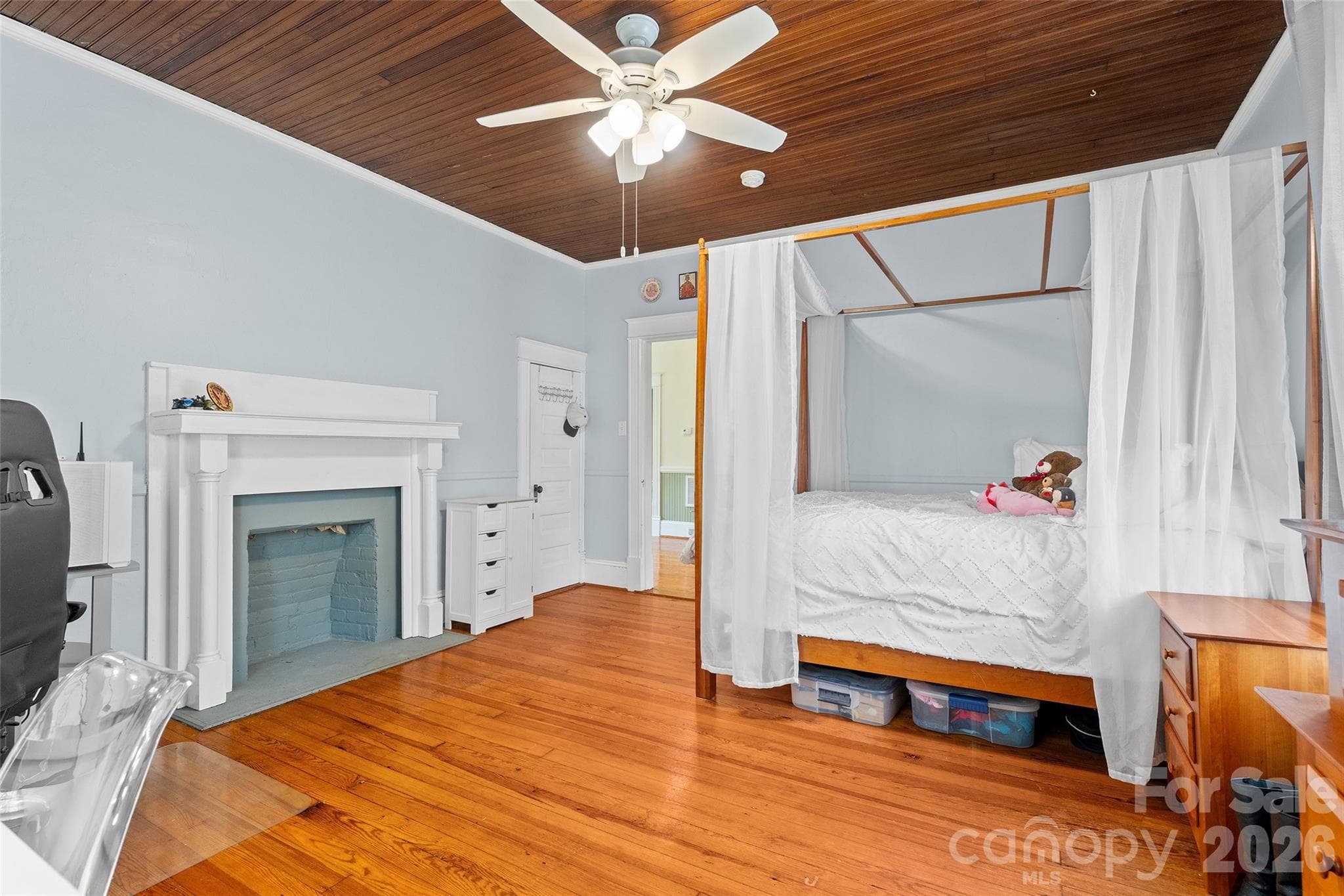 Second floor bedrooms are spacious with hardwood floors, wood bead board ceilings, fireplaces and closets. Bedroom 2 of 5 - 602 N Main Street, Davidson