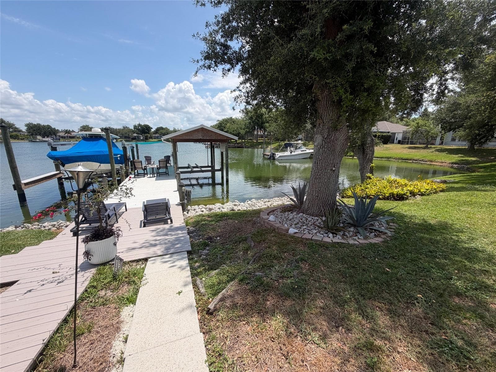Boat dock with covered lift - 217 36TH ST NE, BRADENTON