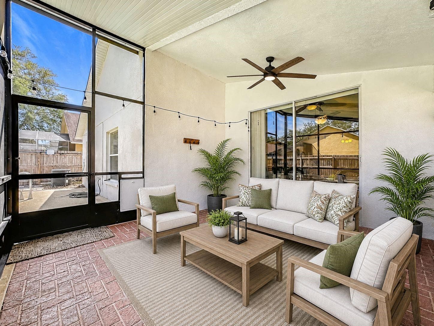 Extended, fully screened-in lanai equipped with an attached exhaust fan—perfect for outdoor dining. - 7116 COLONY POINTE DR, RIVERVIEW