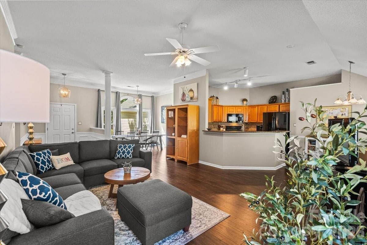 Tall ceilings and an open layout connect the foyer to the living, dining, kitchen and breakfast areas - Charlotte