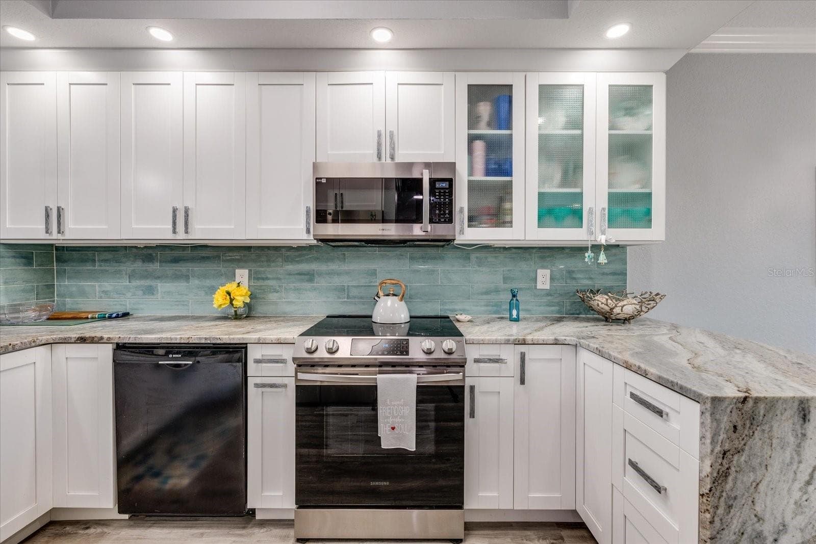 Updated gourmet kitchen with granite featuring waterfall edge - 4801 OSPREY DR S #207, ST PETERSBURG