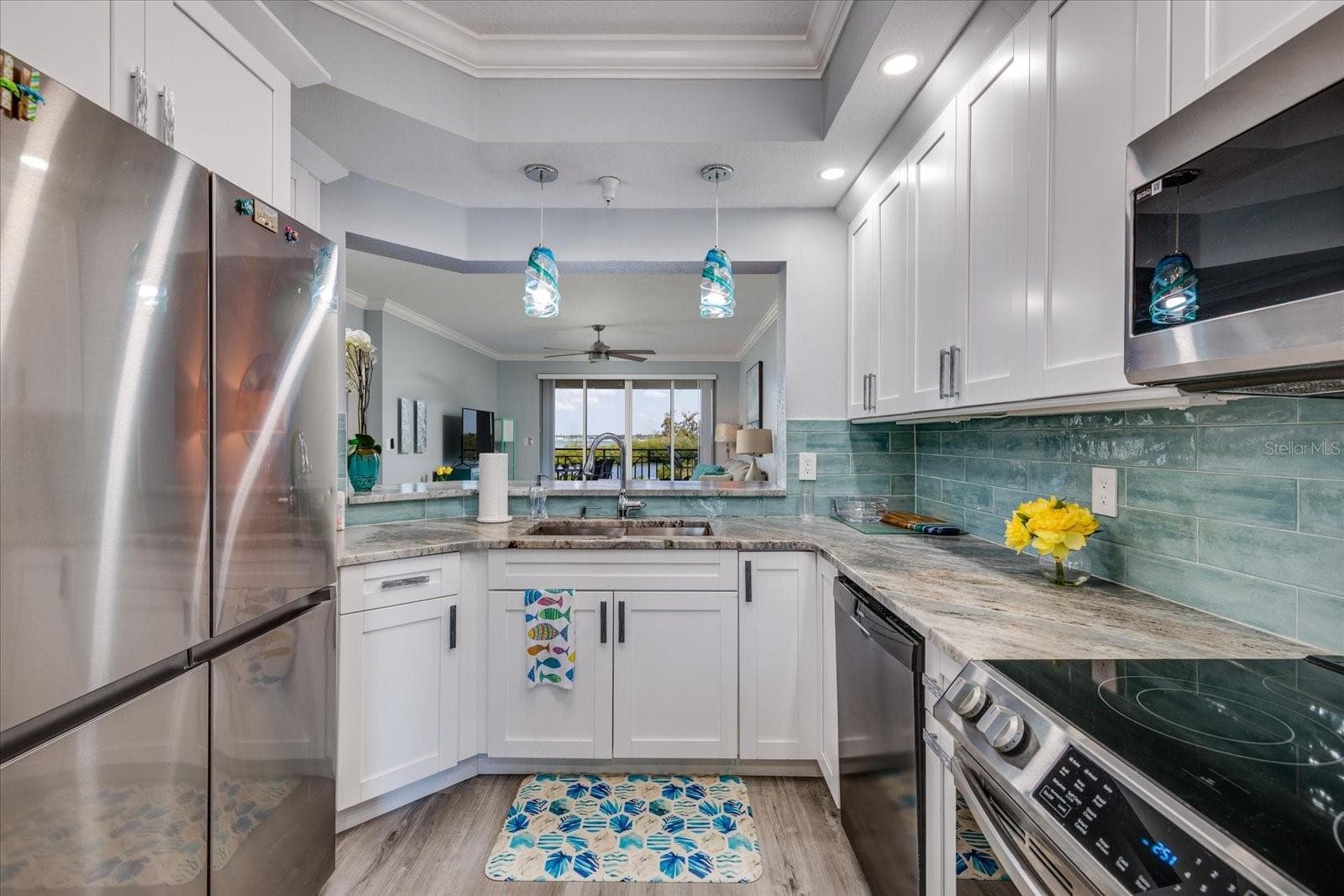 Kitchen overlooks Living Area - 4801 OSPREY DR S #207, ST PETERSBURG
