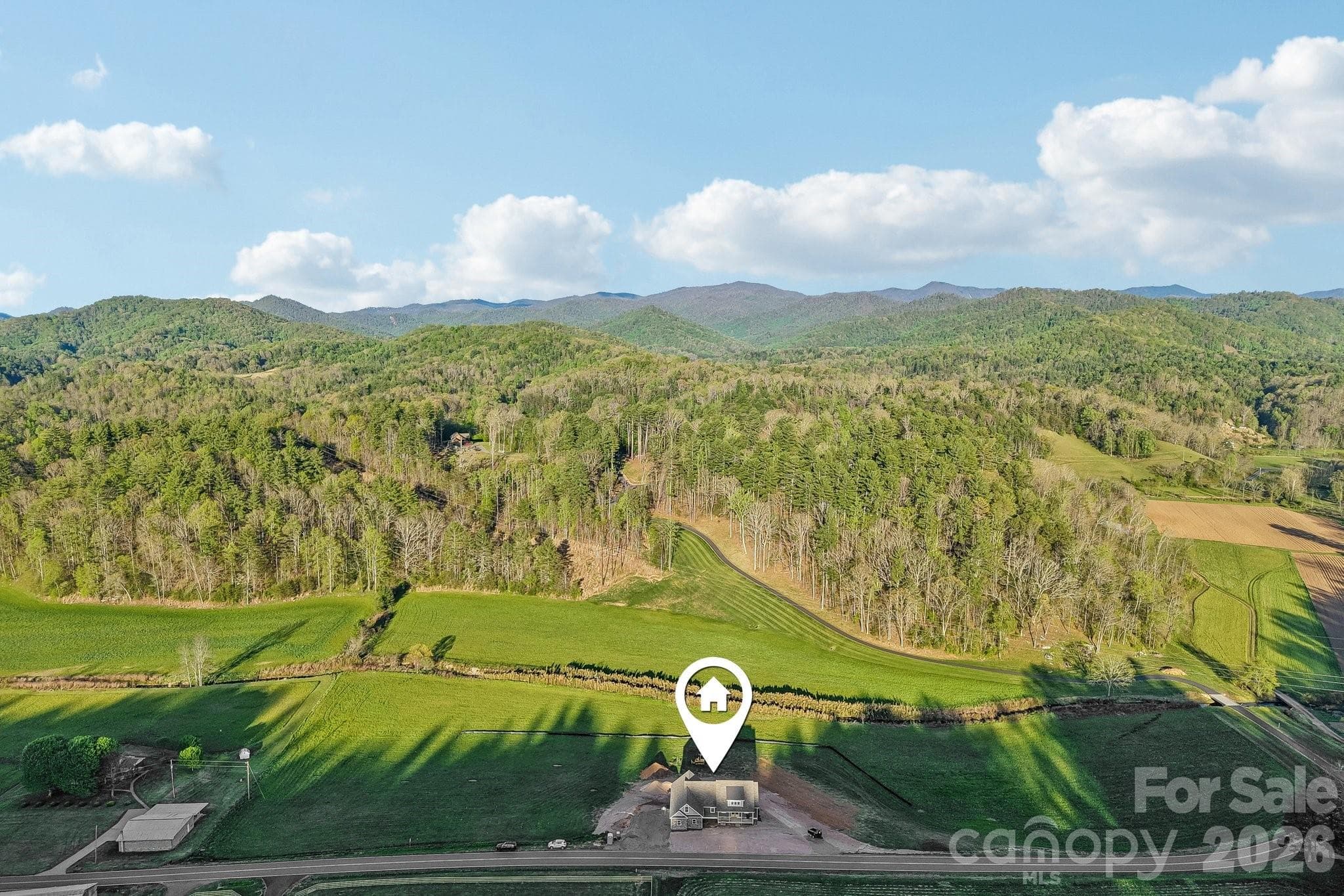 Set in the rolling hills of California Creek sits 1060 Old California Creek Rd. 4 Bed/3 1/2 Bath Home - Mars Hill