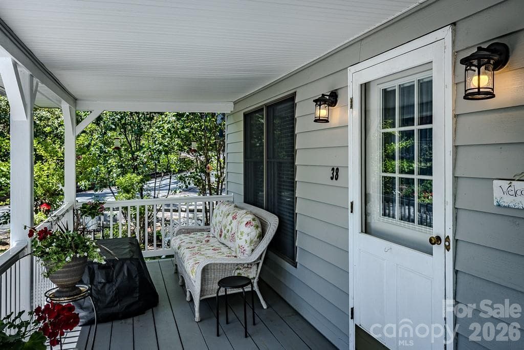 Covered porch overlooking nicely landscaped yard - 38 Rocky Meadows Road, Newland