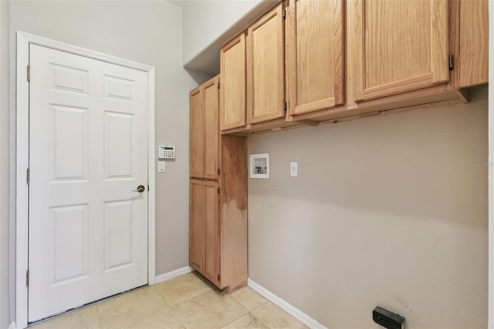 Designated laundry room with storage. - 237 STRATHMORE CIR, KISSIMMEE