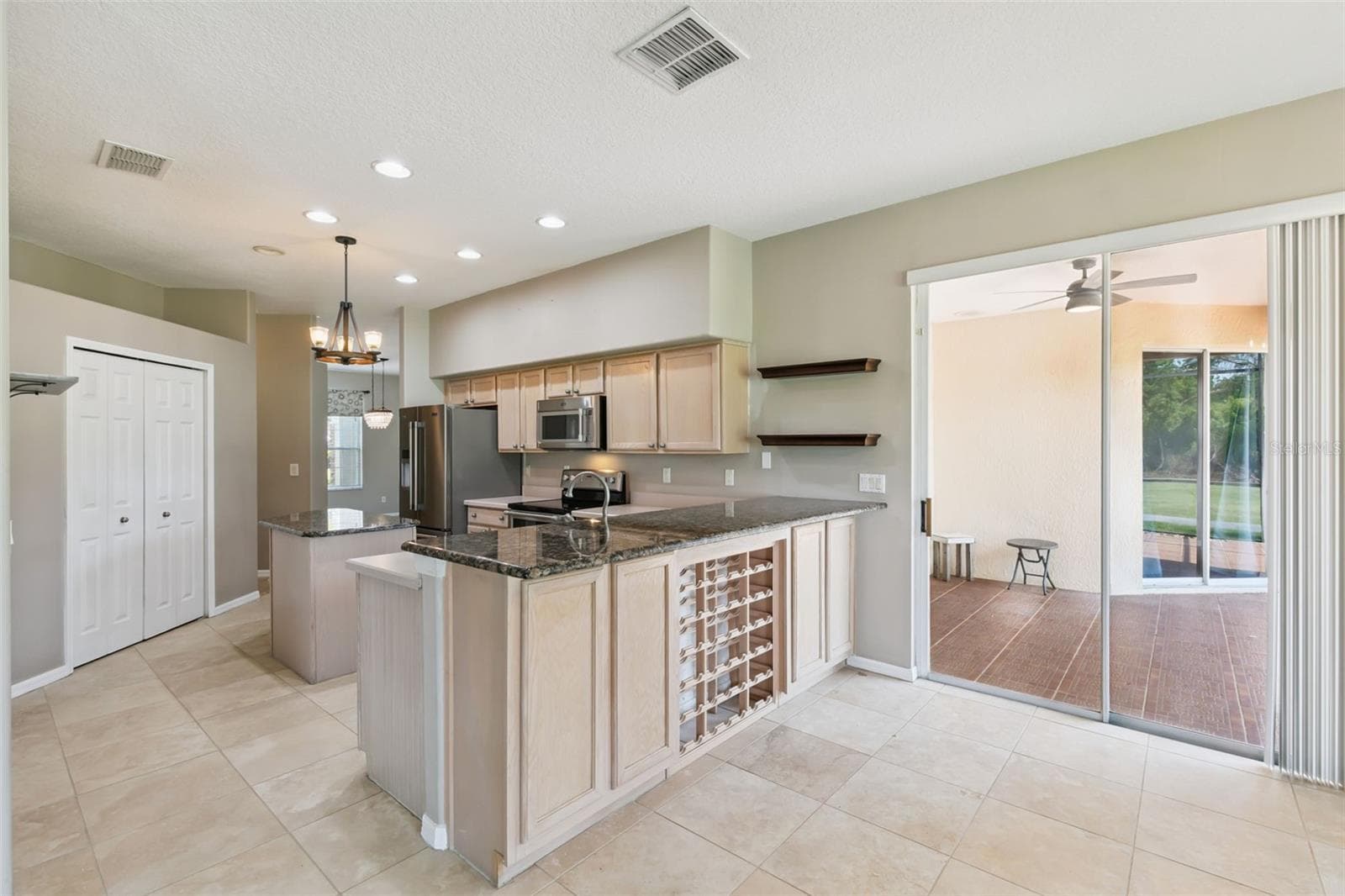 Built-in wine rack and room for bar seating. - 237 STRATHMORE CIR, KISSIMMEE