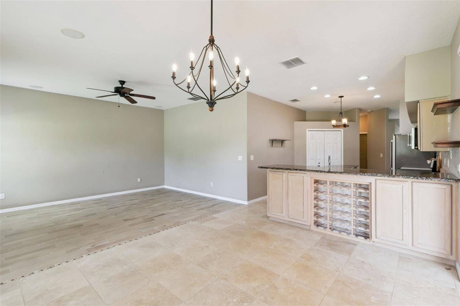 Living room joined with kitchen and extra space. - 237 STRATHMORE CIR, KISSIMMEE