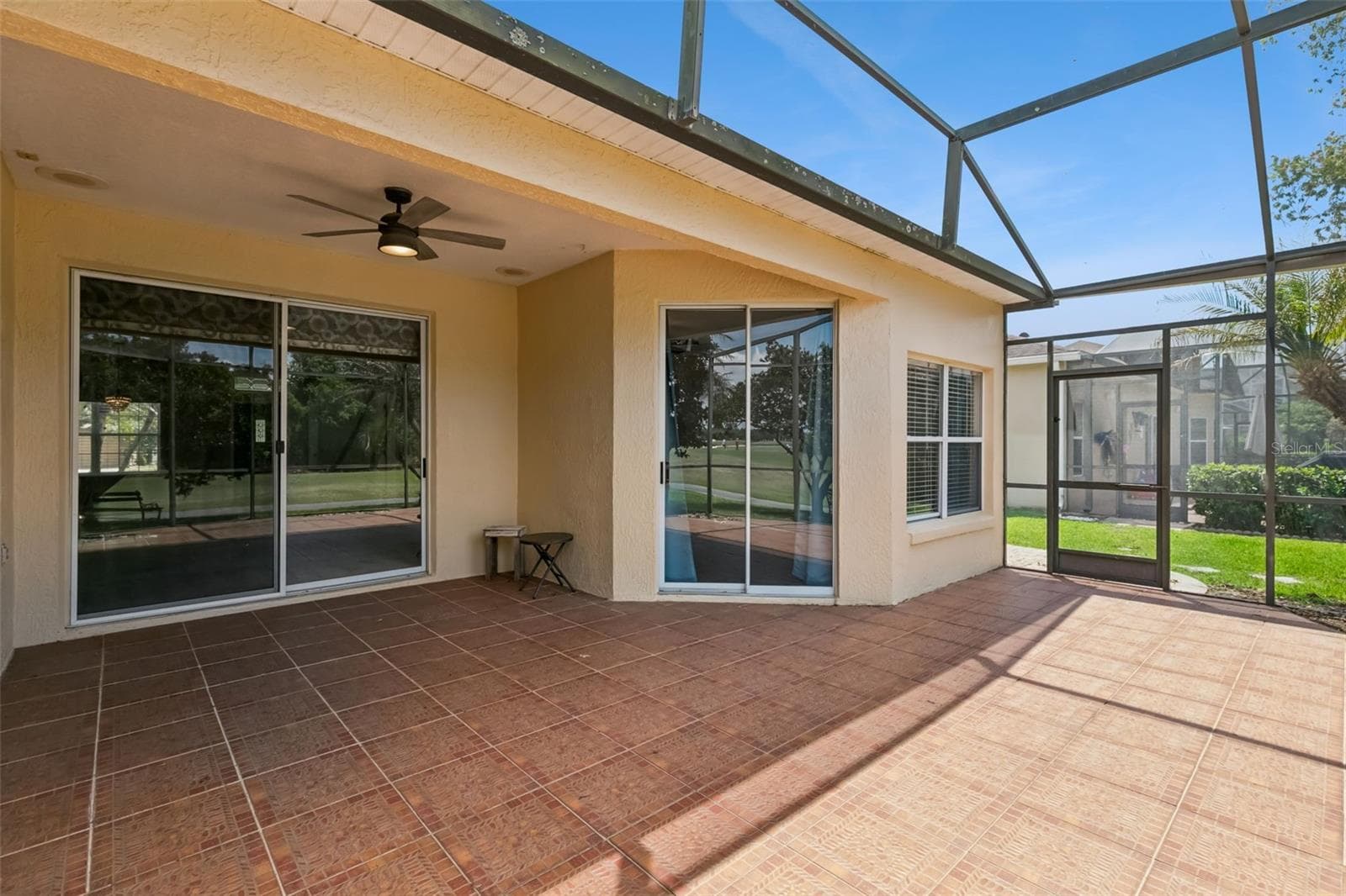 Large screened patio, accessible from 3 interior areas. - 237 STRATHMORE CIR, KISSIMMEE