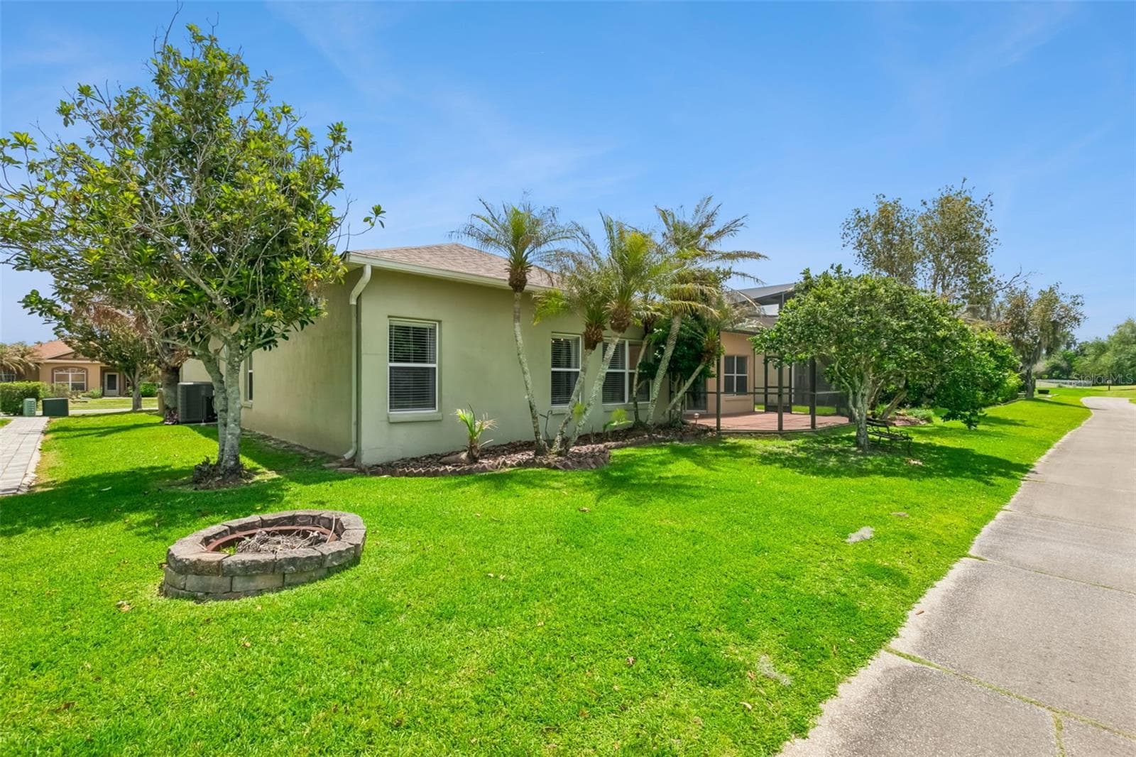 Rear view of the home from cart path. - 237 STRATHMORE CIR, KISSIMMEE
