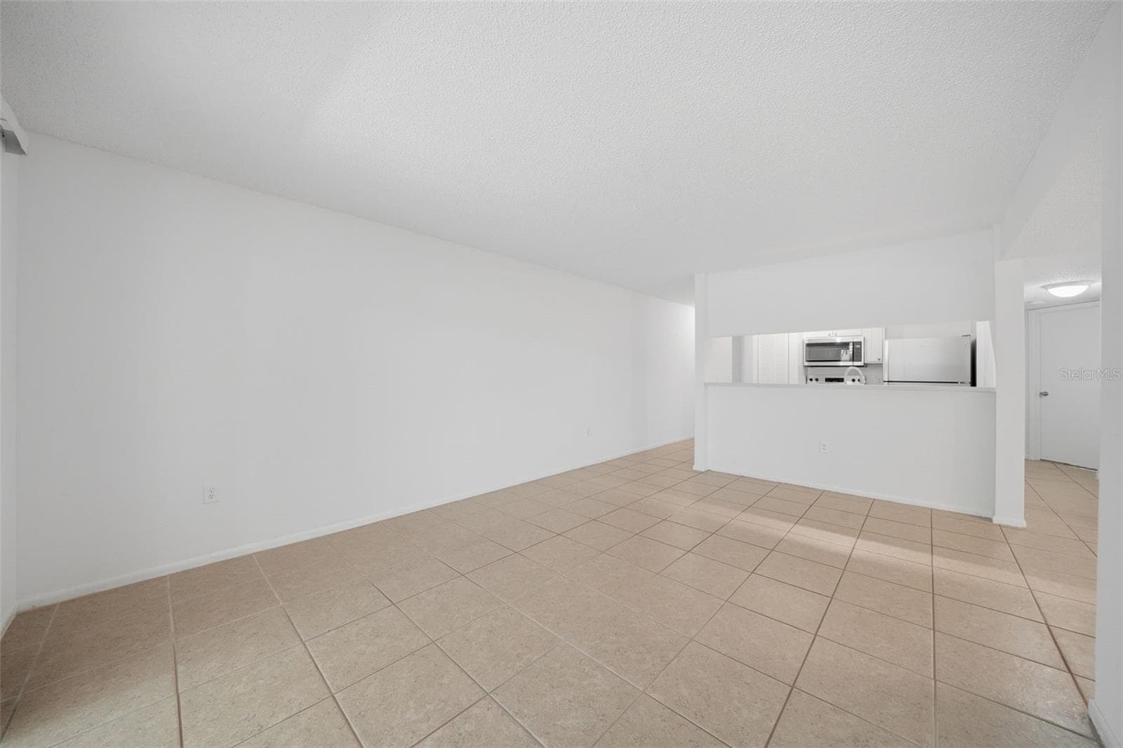 Living Room to kichen - 3001 58TH AVE S #1005, ST PETERSBURG
