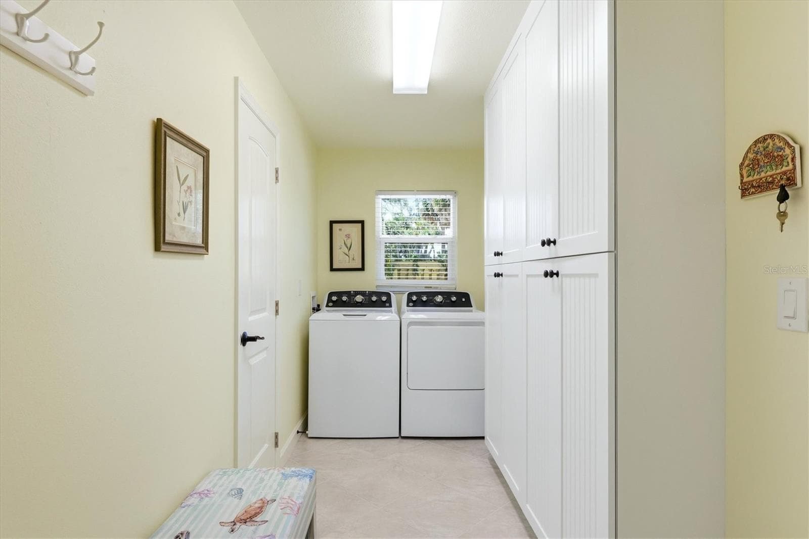 Downstairs Indoor Laundry Room with added cabinetry for storage - 6421 MANASOTA KEY RD, ENGLEWOOD