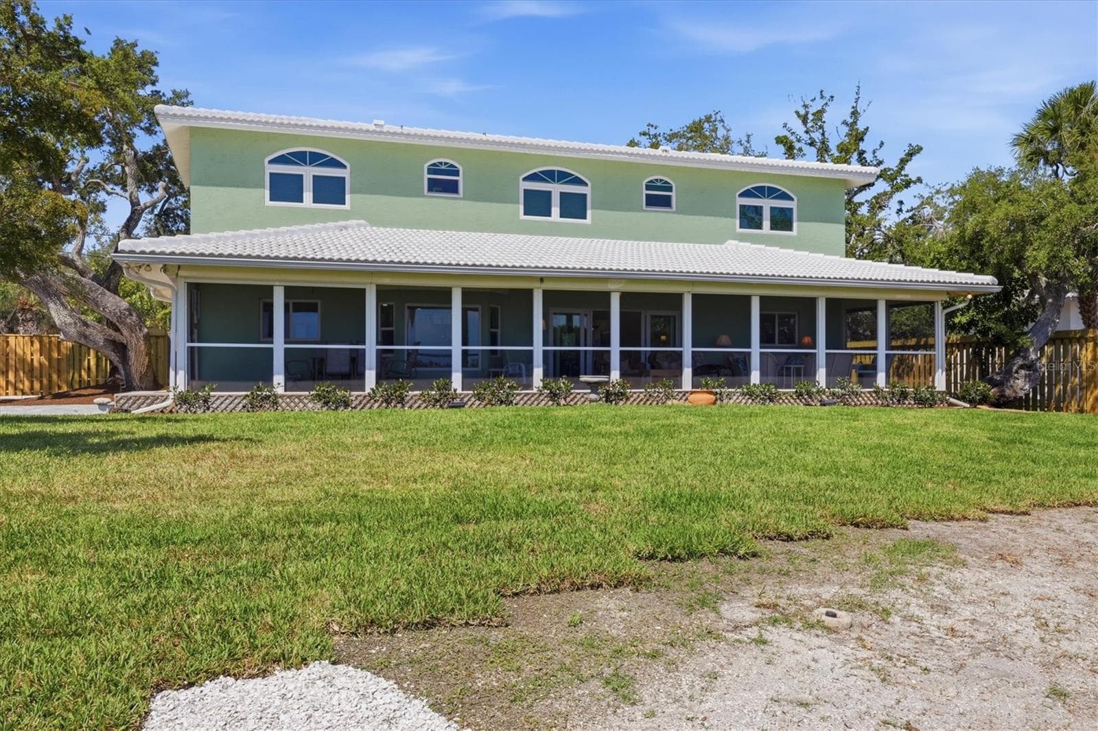 Back View of Home With Large Screened Lanai - 6421 MANASOTA KEY RD, ENGLEWOOD