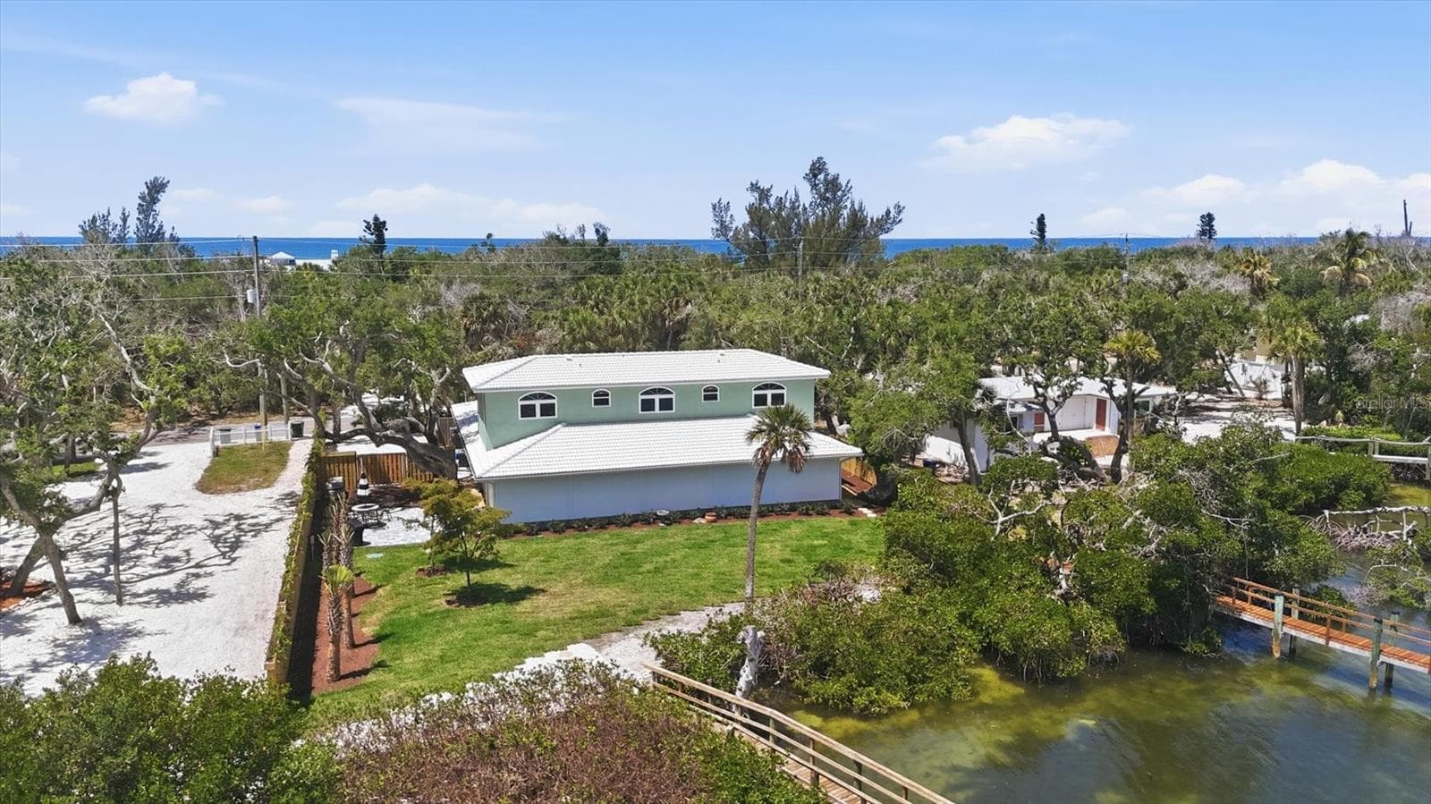 Aerial of Back of Home with Hurricane Shutters - 6421 MANASOTA KEY RD, ENGLEWOOD