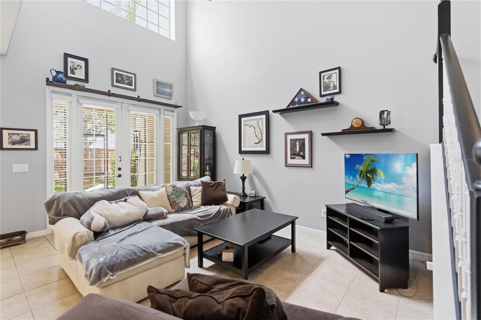 Family room as seen from the kitchen with 24' ceiling. - 534 TERRACE SPRING DR, ORLANDO
