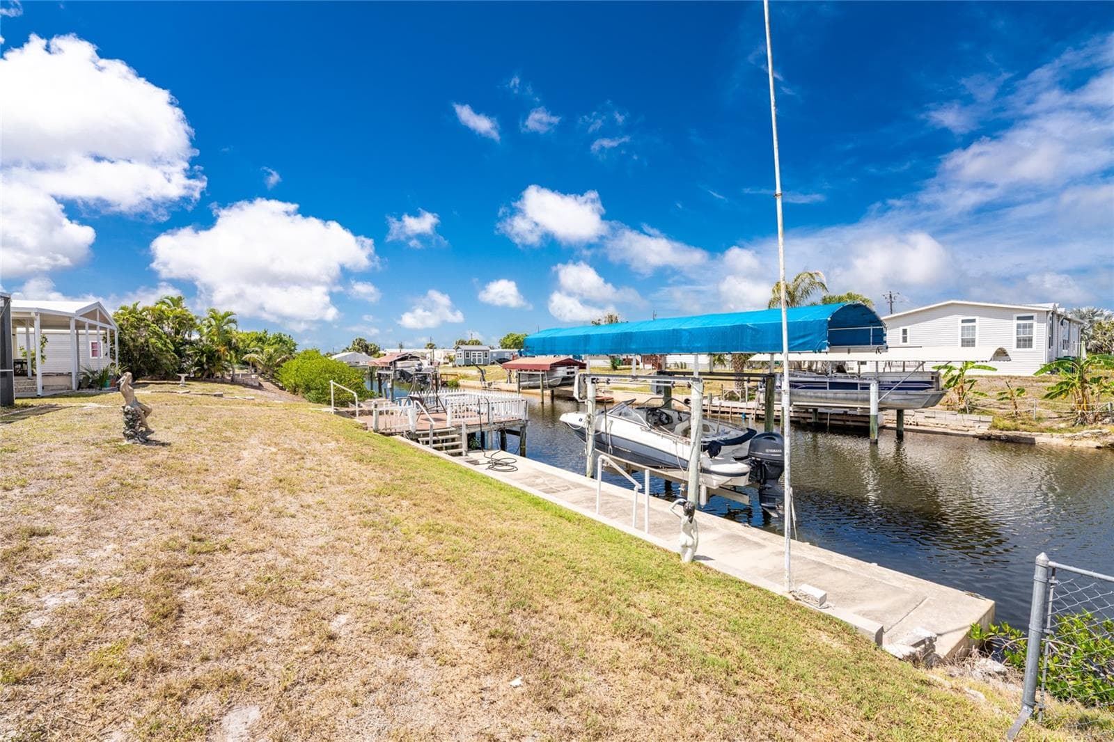 Concrete seawall, dock, and covered lift! - 1380 SEAGULL DR, ENGLEWOOD