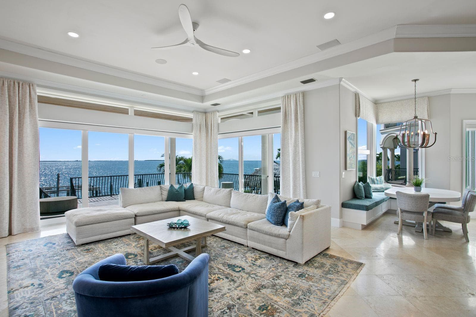 The family room and breakfast area are perfectly positioned to capture sweeping wide-open water views. - 611 1ST AVE S, TIERRA VERDE