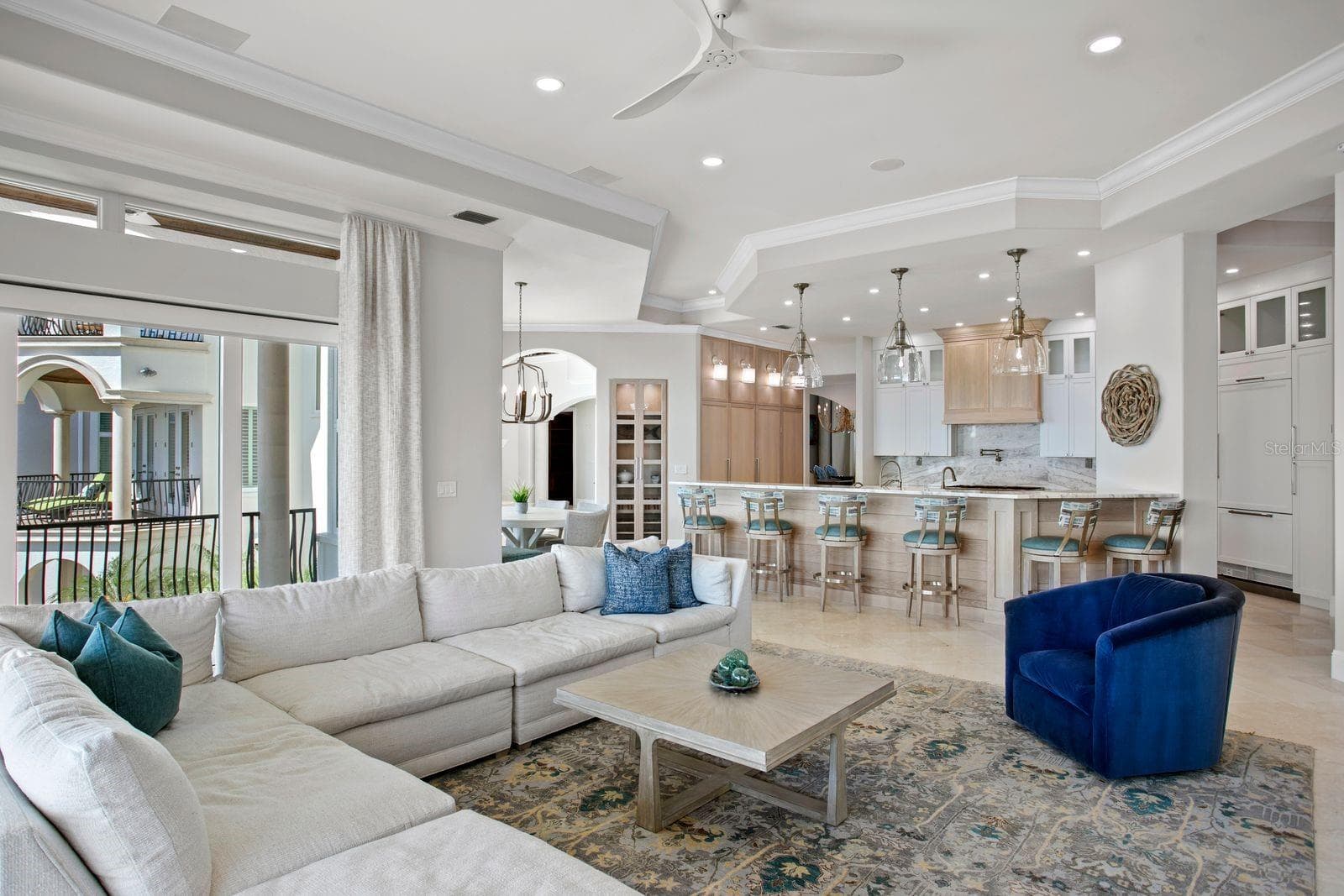 A beautifully integrated layout blends the kitchen and family room into one expansive gathering space. - 611 1ST AVE S, TIERRA VERDE